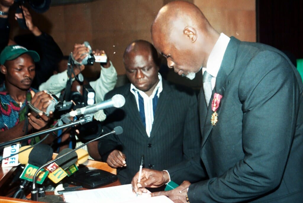 Djimon Hounsou signs the book after receiving a distinction in his home country Benin 
