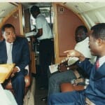 With oil mogul Samuel Dossou on his private jet