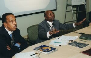 Then-CCA's president, Percy Wiison, left, with an unidentified speaker during CCA's Second Summit held in Houston, Texas, in April 1999