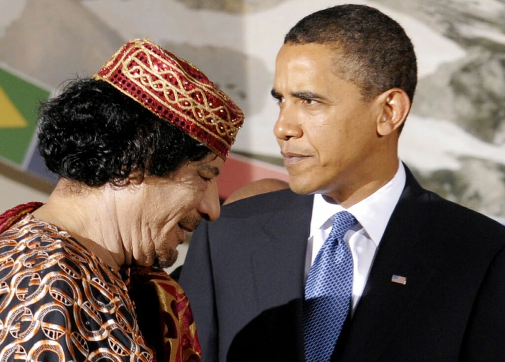US President Barack Obama, right, and Libyan leader Moammar Gadhafi pictured during the G8/G5 summit in L'Aquila, Italy on July 9, 2009