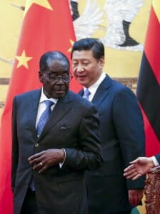 Zimbabwe's President Robert Mugabe (L) and his Chinese counterpart Xi Jinping during a signing ceremony at the Great Hall of the People in Beijing August 25, 2014. Image by. REUTERS/Diego Azubel/Pool 