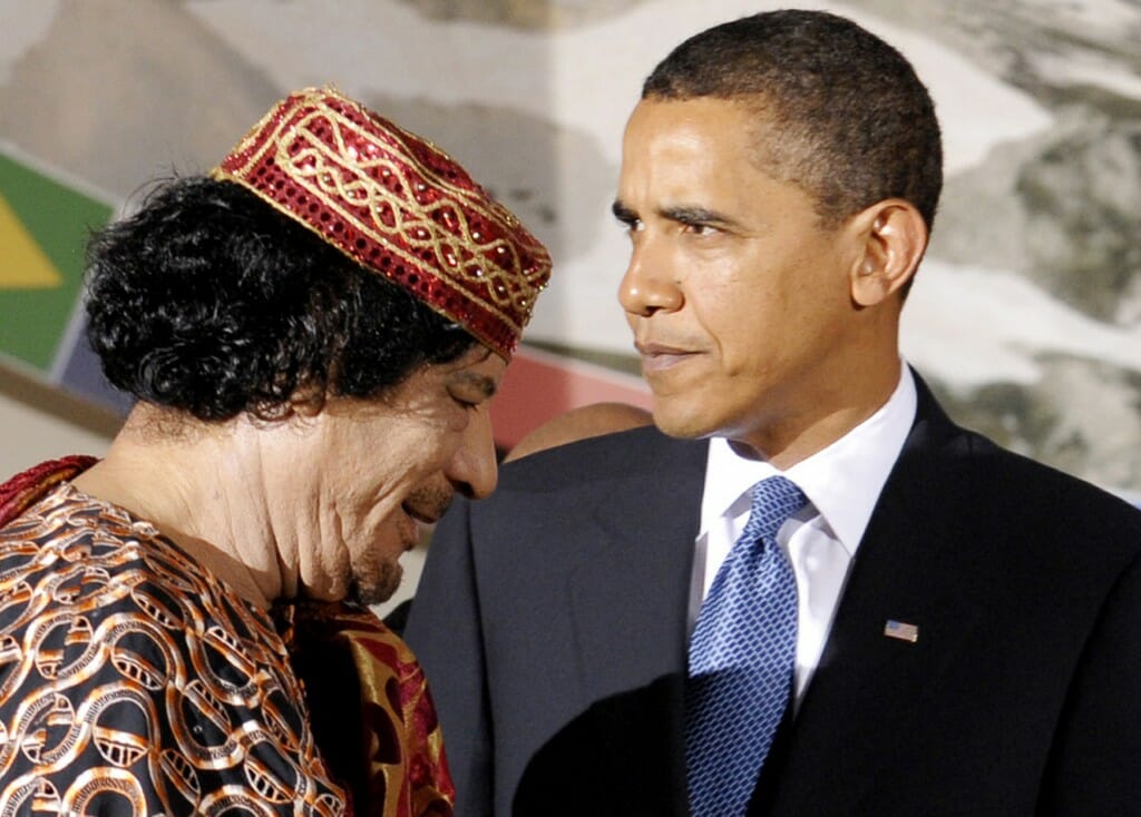President Obama meets with then-Libyan leader Muammar Gaddafi in Italy in 2009 during the G8 Summit.