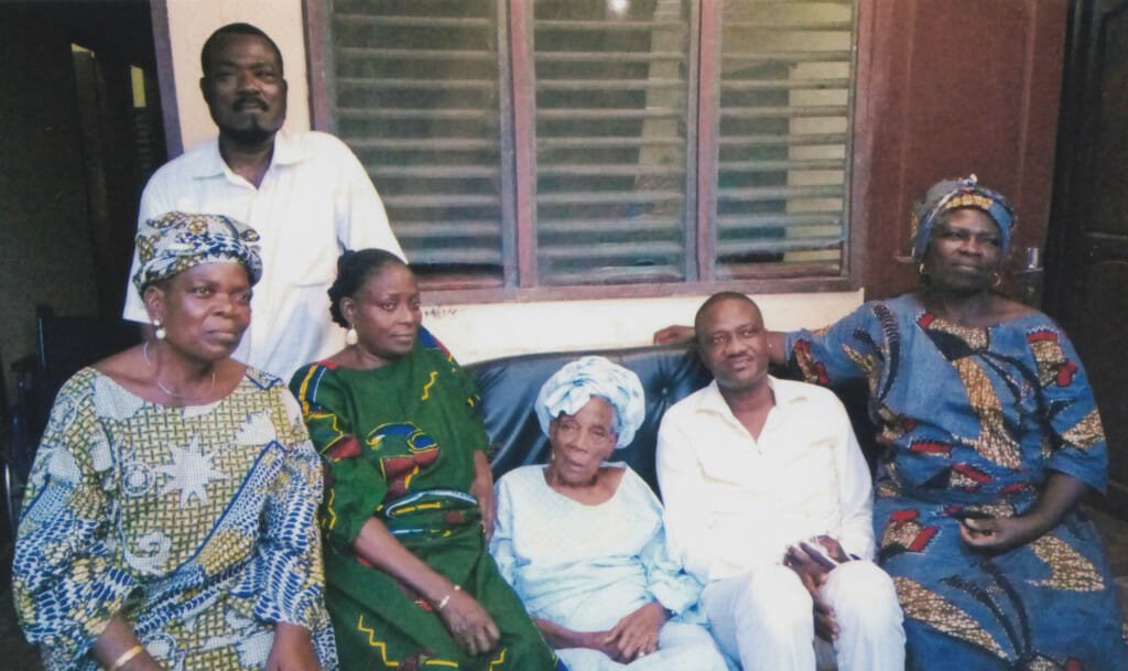 In this picture shot in September 2016, Hadeejah is surrounded by five of her six children: Standing: Oldest son Soumanou Salifou, a magazine publisher, 69; seated, from left to right: Ossila, trader, 58; Affoussa, restaurateur, 66; Hadeejah Salifou, 95; Ganiou, businessman, 54; 