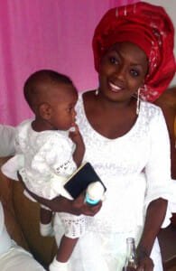 Grand-daughter Elysée Boco, a top-notch beautician, carrying her now-2-year son, Splendid.