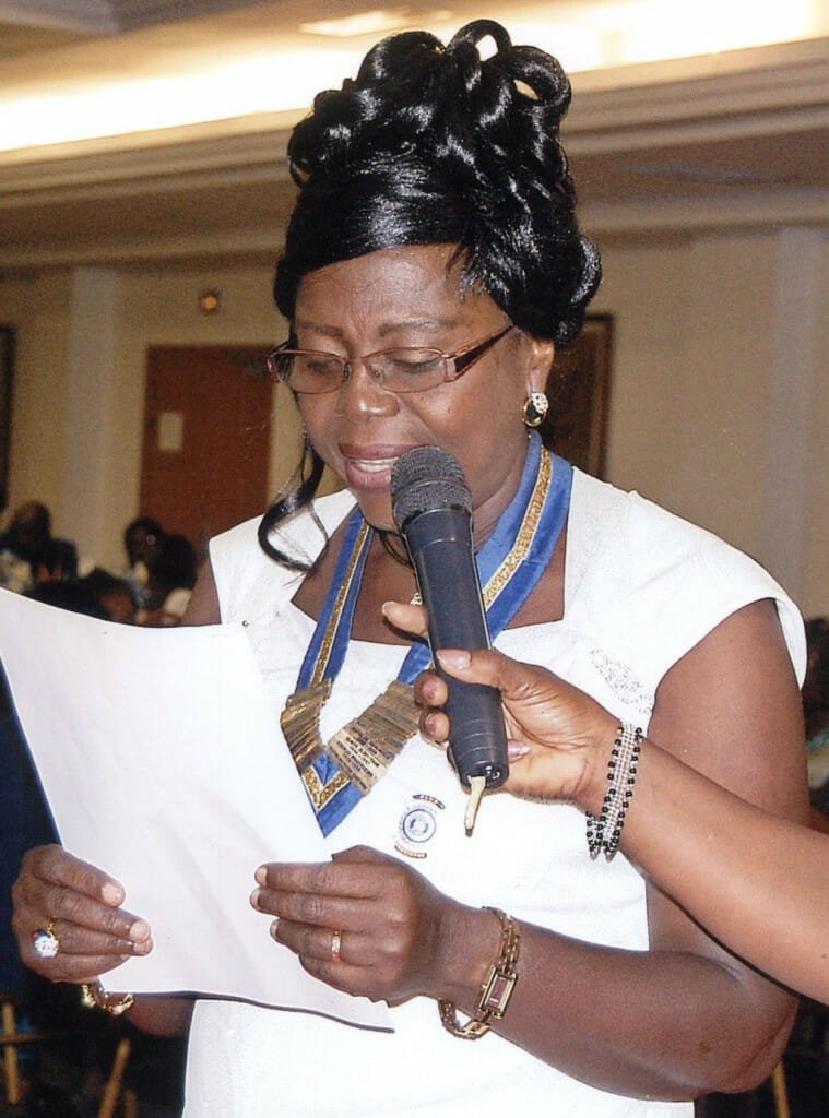 Inner Wheel Cotonou's president, Jeanne Godonou, addresses the Inner Wheel annual gala.