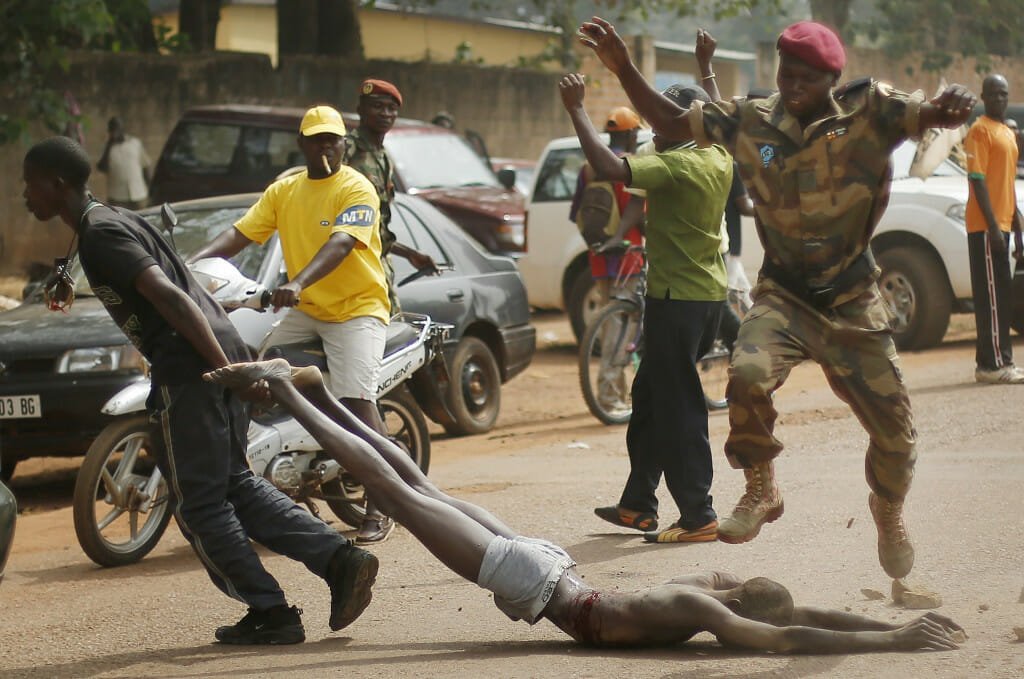 A dead body being dragged on the street of Bangui