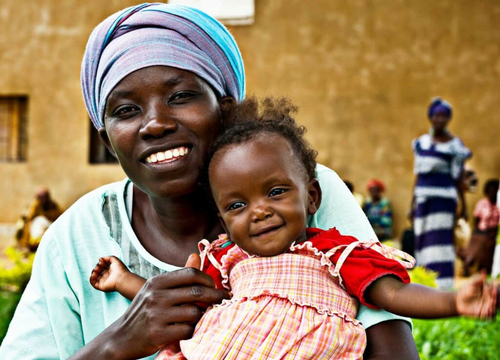 A mother holds her child at a family-planning center in Africa