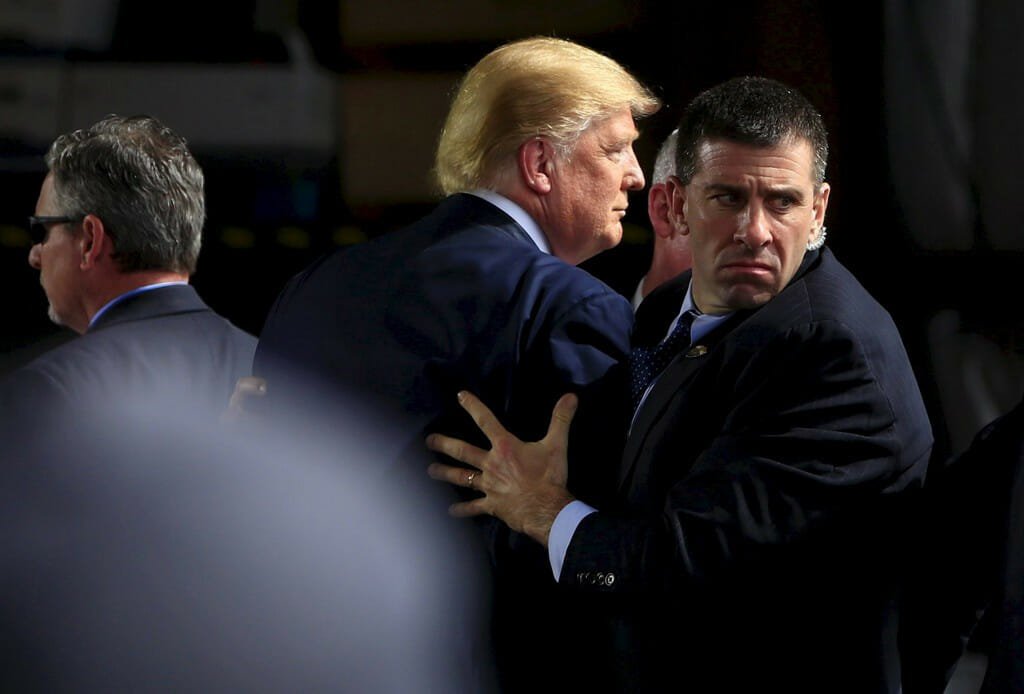 Presidential candidate Donald Trump shielded by Secret Service agents during a campaign event in 2016