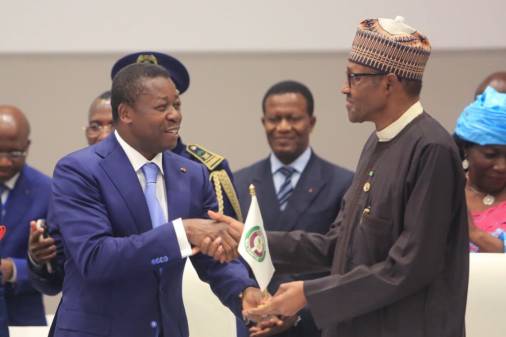 Gnassingbe shakes hands with Buhari