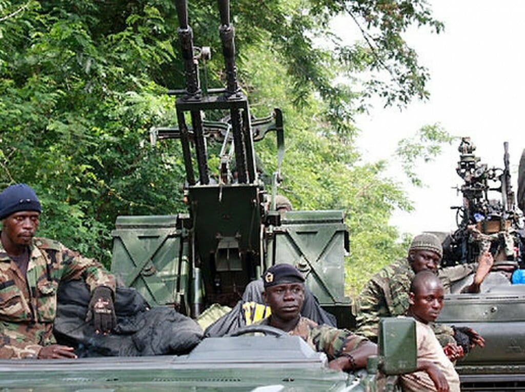Members of Pro-Ouattara forces hold their weapons in Duekoue, in western Ivory Coast. The International Committee of the Red Cross said at least 800 people were killed in unrest at Duekoue this week (DOSSO/Getty)  