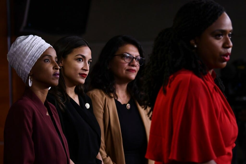 U.S. Rep. Ayanna Pressley speaks as, from left, Reps. Ilhan Omar, Alexandria Ocasio-Cortez and Rashida Tlaib look on. PHOTO: BRENDAN SMIALOWSKI/AGENCE FRANCE-PRESSE/GETTY IMAGES