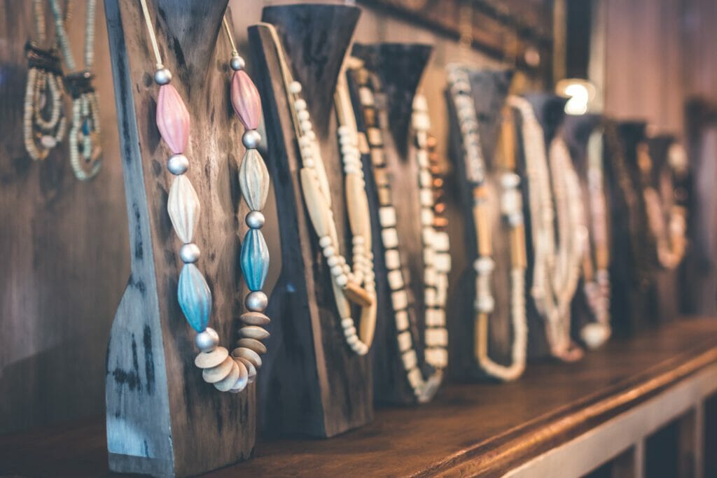 A display of necklaces made of wood and beads