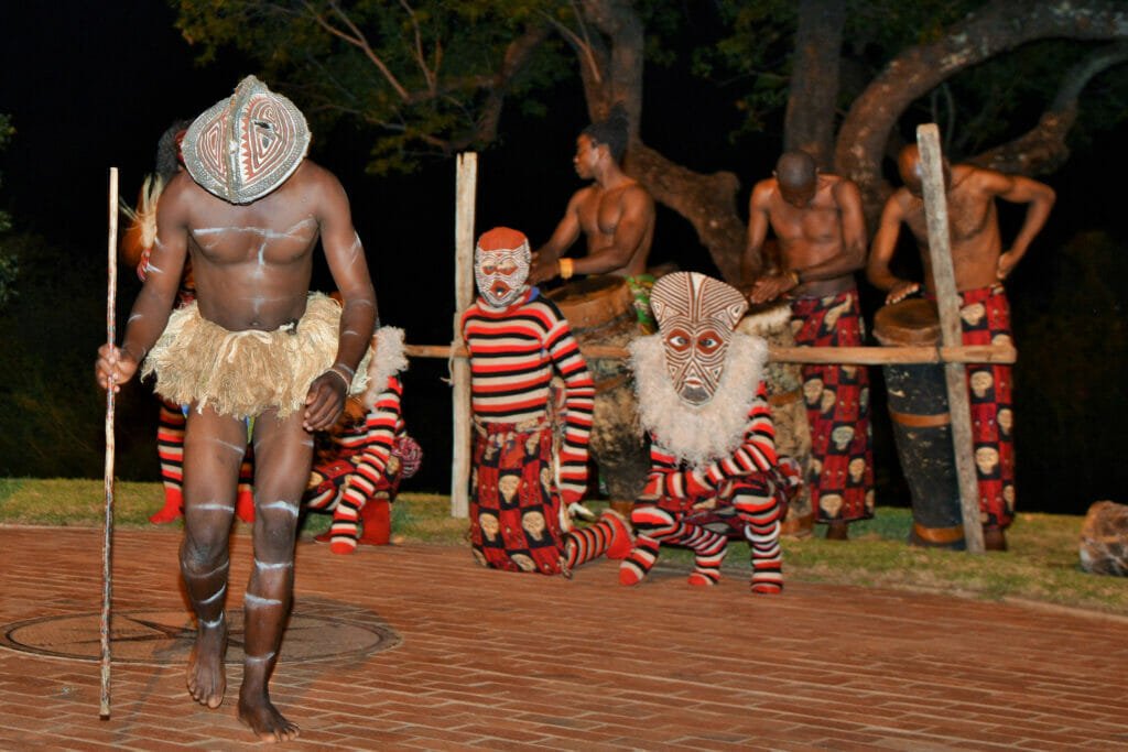 Zimbabwean Makishi dancers perform rituals during the coming-of-age transition from boyhood to manhood.