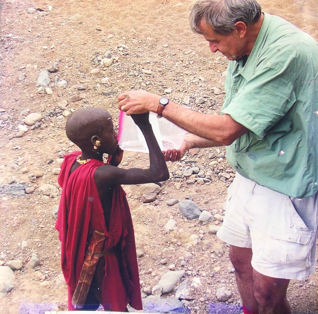 "Africa's Children Need Guardian Angels" Jeff Fadiman giving Maasai herds boy water