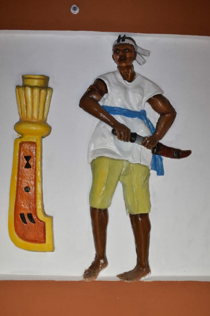 The drawing of an agodji wearing the “tchanka,” a special pair of trousers. This image, on a wall at the Kingdom of Cana, was shot by The African photographer Arsene Kassegne