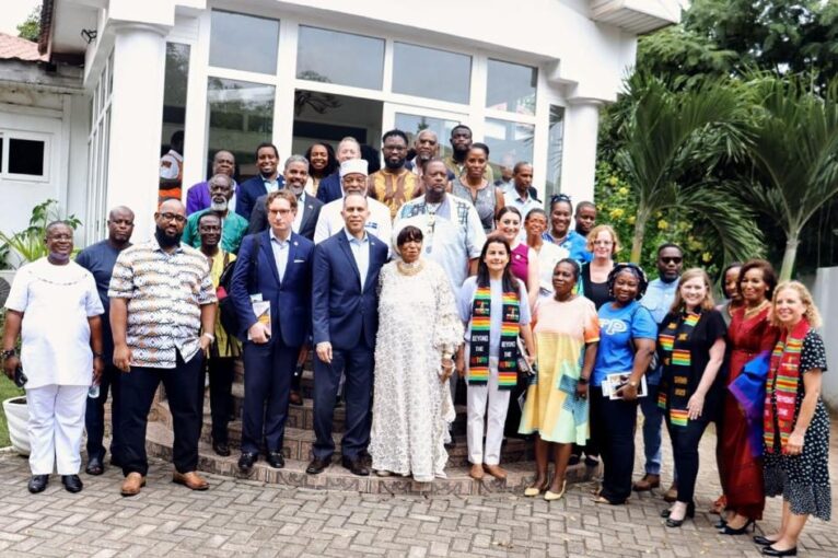 Family picture in front of the Diaspora African Forum building