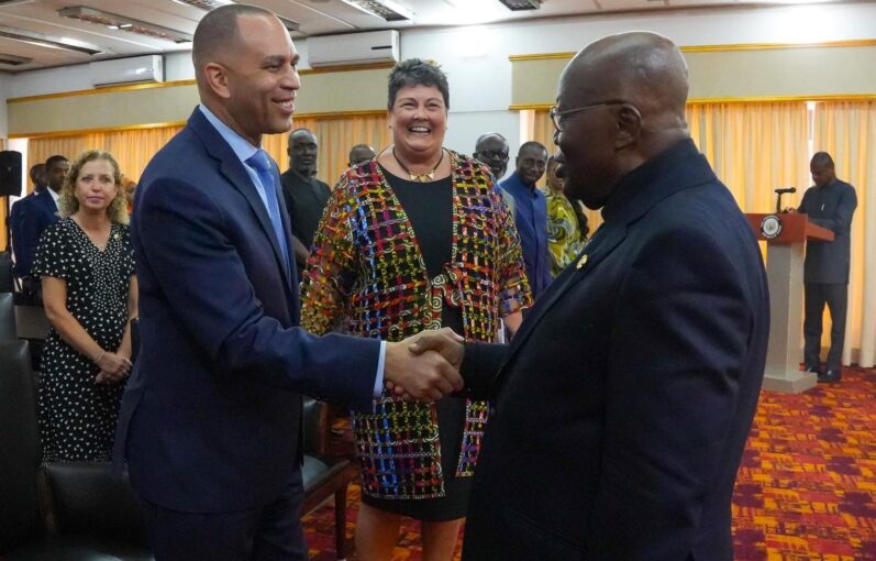 The Democratic leader of the U.S. House or Representatives, Hakeem Jeffries, left, shakes hands with Ghana's president, Nana Kuffo-Ado