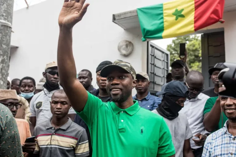 Opposition leader Ousmane Sonko waves to his supporters during a meeting in Ziguinchor on May 24, 2023 [Muhamadou BittayeAFP]