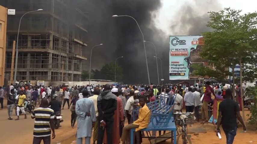 Supporters of the coup set ablaze the headquarters of the ruling party