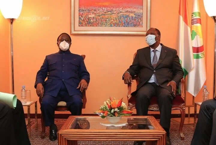 Former Ivorian President Henri Konan Bedie, left, meets with the current president, Alassane Ouattara, in November 2020