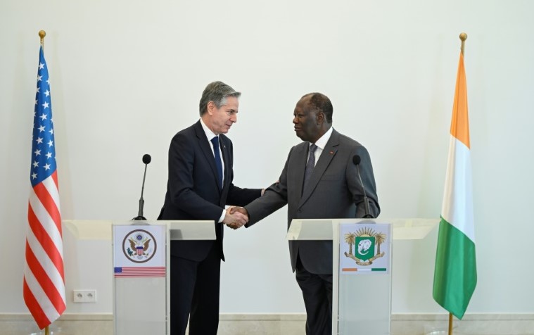 U.S. Secretary of State Antony Blinken shakes hands with Ivorian President Alassane Ouattara January 22 in Abidjan, Cote d'Ivoire