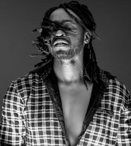 Oksylver, aka Okumu Sylvester Douglas, a Ugandan author whose vast artistic talents span music, acting, modeling, writing, and directing
