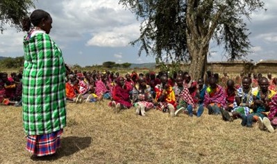 A female representative of Mulika Africa teaching female hygiene practices and connecting with the community.
