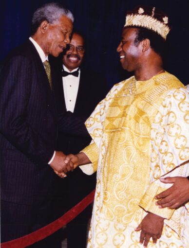 Then-South African President Nelson Mandela (left) shakes hands with President Nicephore Soglo of Benin. Image by Damien Padonou