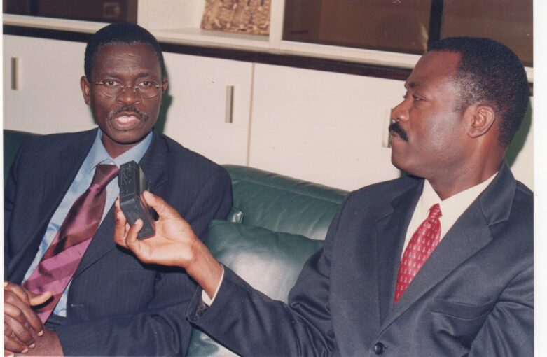 Then-new Chairman of the ECOWAS Bank for Investment and Development, Christian Adovelande, left, grants The African founder and publisher an exclusive interview in his office in Lome, Togo, in July 2002. Image by Arsene Kassegne.