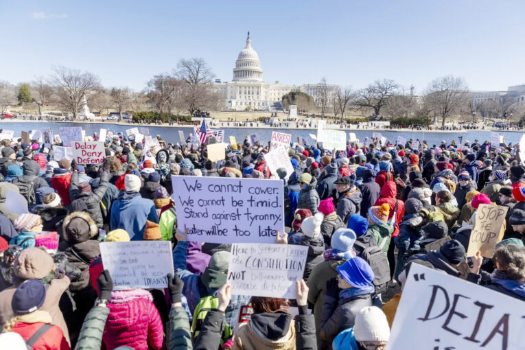 Thousands gathered in Washington, D.C., to protest the Trump administration's policies on President's Day 2025. Credit NPR