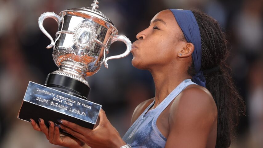Coco kisses the trophy.