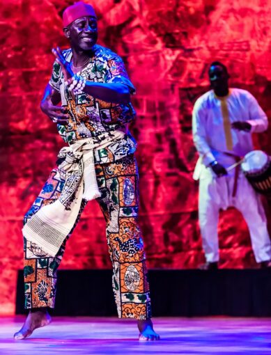 A typical gracious performance by Assane Konte, fondly called Papa Assane, co-founder and artistic director the KanKouran West African Dance Company, performs. Image courtesy of the KanKouran West African Dance Company..