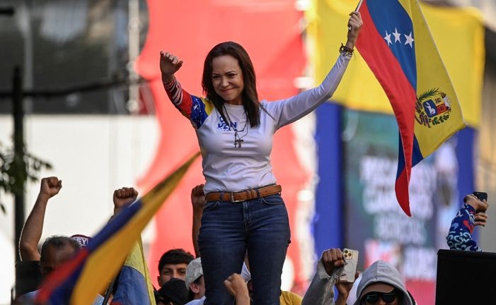 Venezuelan opposition leader María Corina Machado speaks to supporters during a demonstration on the anniversary of the 1958 uprising that overthrew a military dictatorship, at the Altamira square in Caracas on January 23, 2024. | AFP/Gabriel Oran
