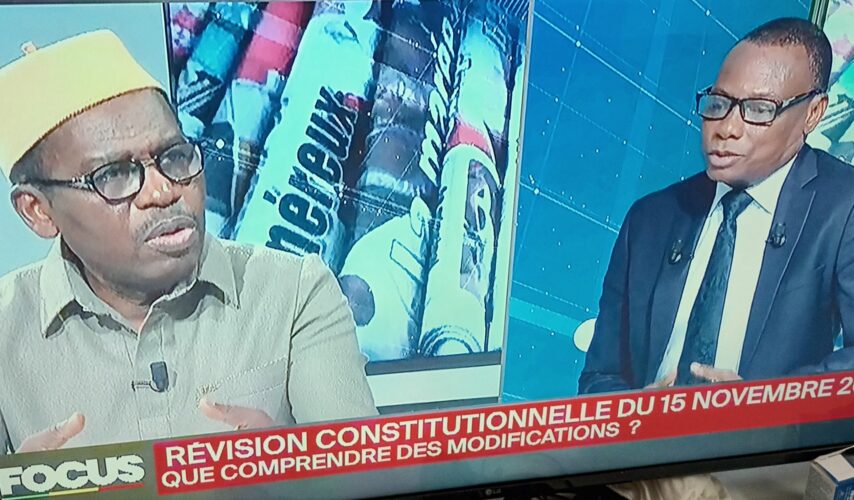 Orden Alladatin, chairman of the Benin parliament judiciary committee, left, with Benin TV anchor Ozias Sounouvou