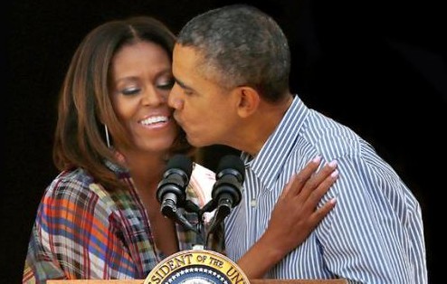 Then-President and first lady Michelle Obama kissing during a Black History Month event at the White House.